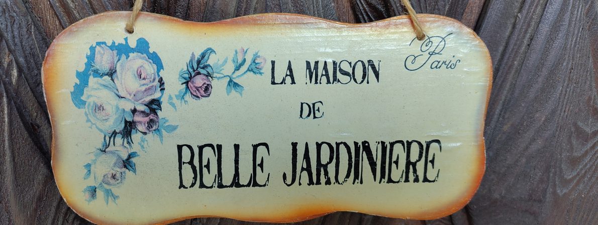 Schild: La Maison de Belle Jardiniere